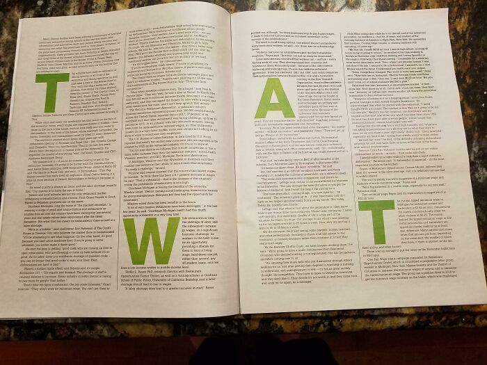 A book with green letters on it Description automatically generated