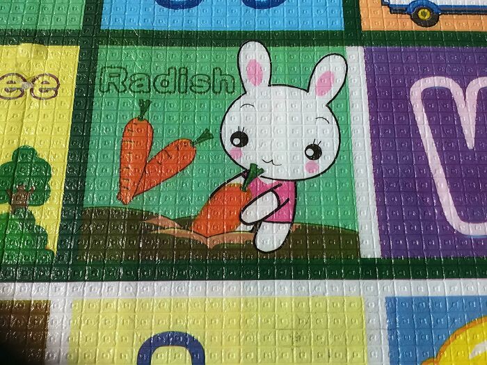 A colorful puzzle with cartoon rabbit and carrots Description automatically generated