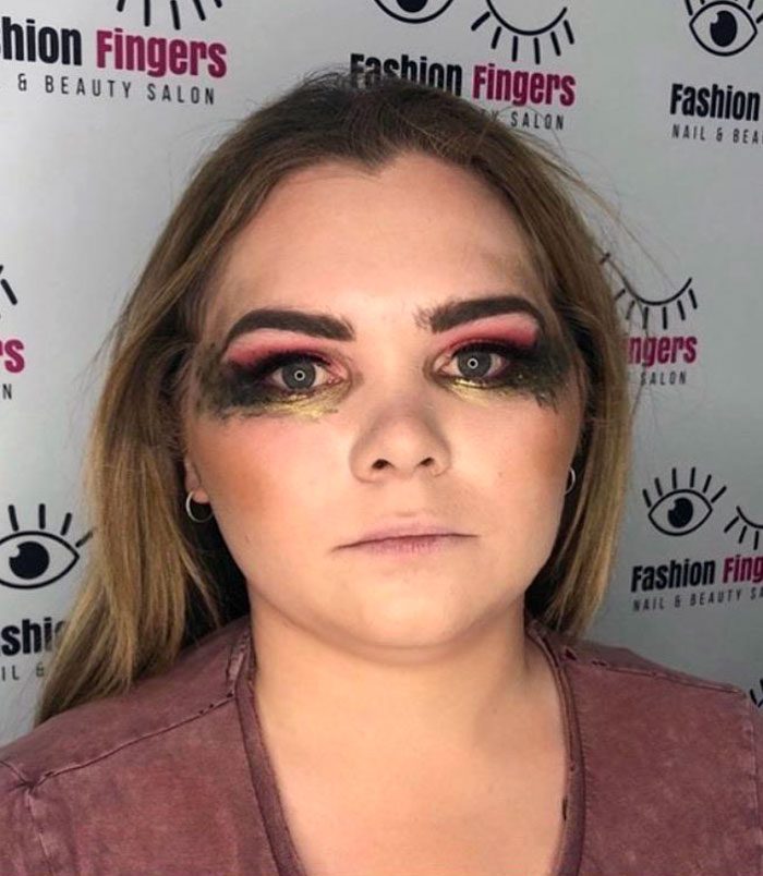 A person with makeup on her face Description automatically generated
