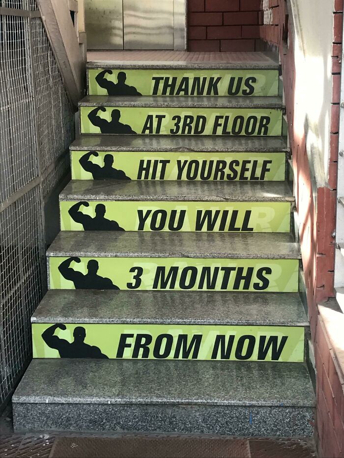 A set of stairs with words on them Description automatically generated