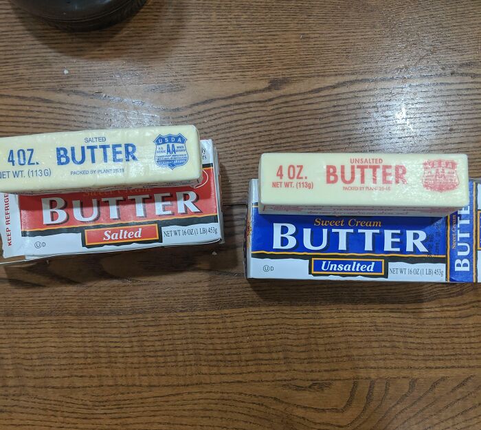 Two boxes of butter on a table
Description automatically generated